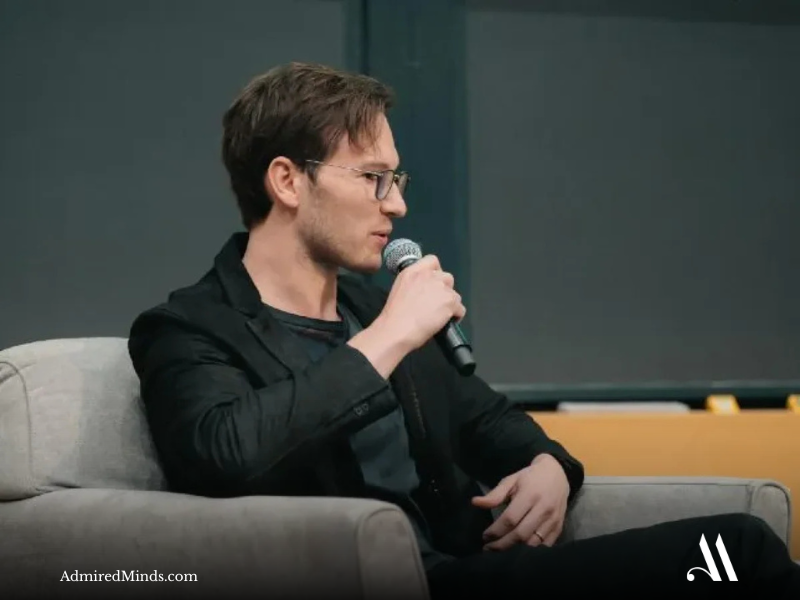 Henrique Dubugras at a tech conference discussing fintech